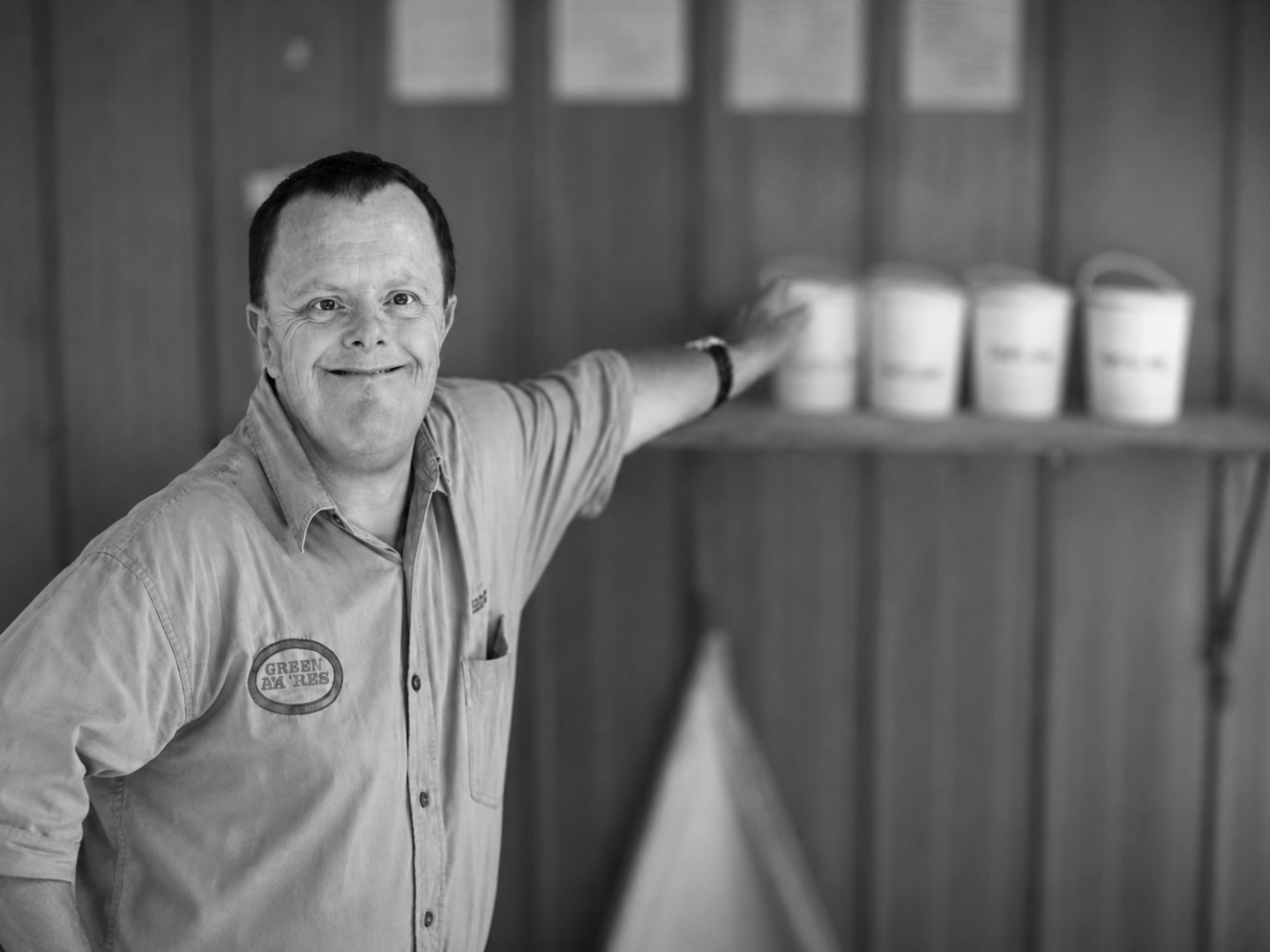 Kelvin Forrest, a man with Down syndrome, smiling in a work shirt.
