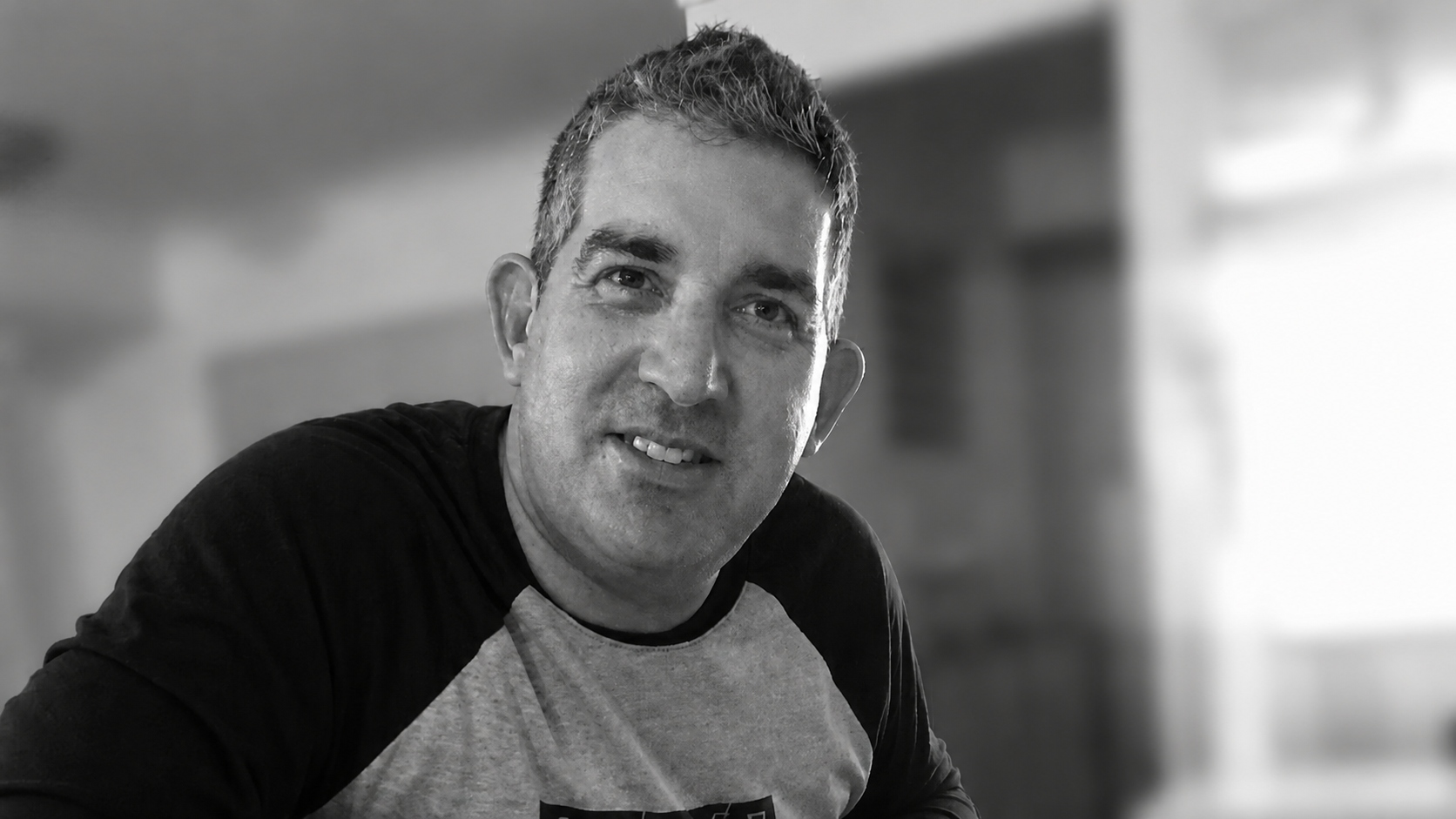 Stewart Kelly, an autistic man, looking towards the camera.